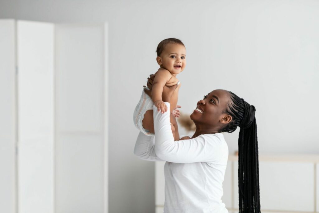 Lady holding a baby at daycare