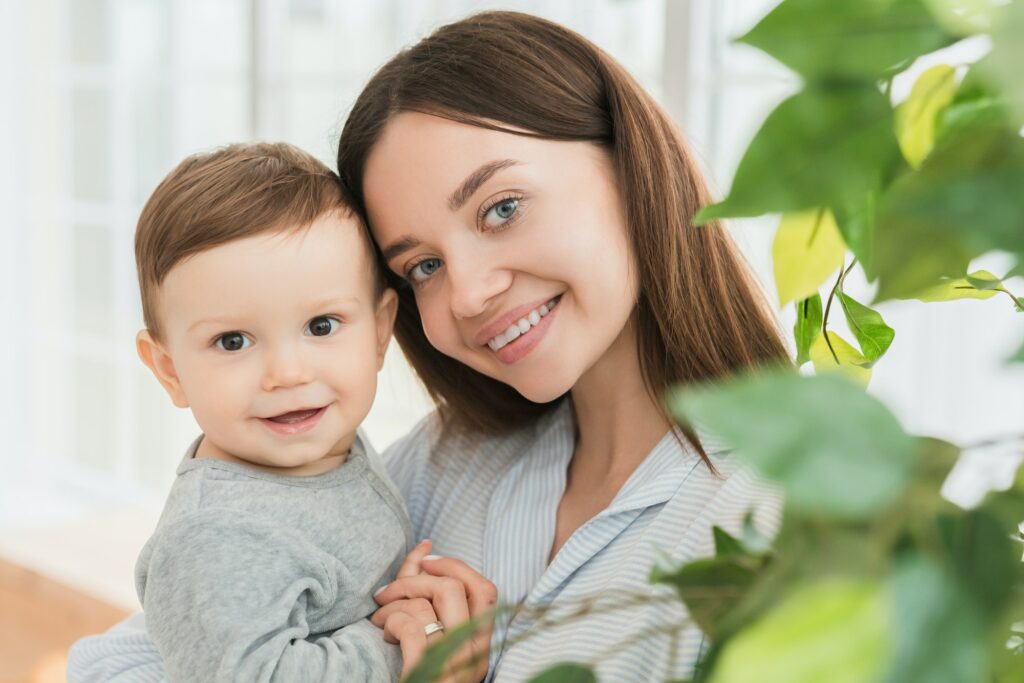 Lady smiling with a baby, at a day care
